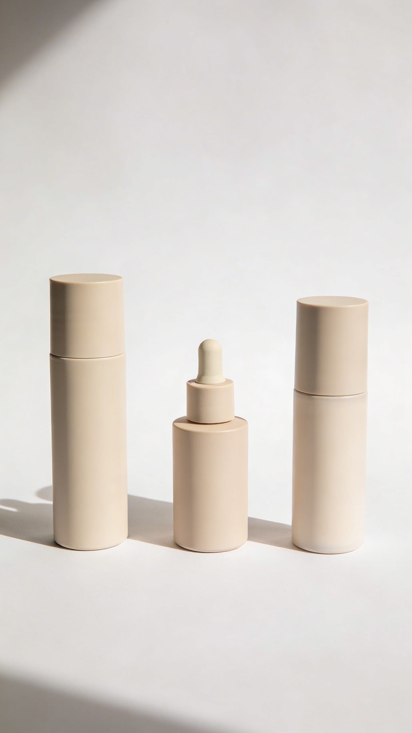 Minimal skincare flatlay: cleanser, serum, moisturizer, no parabens